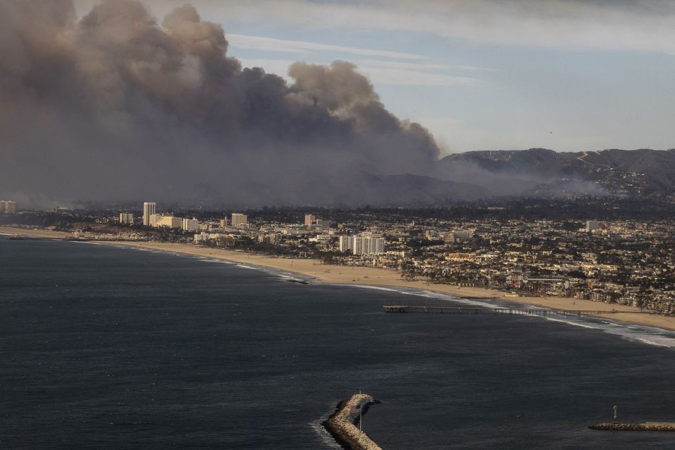 Smoke from the Palisades fire could be seen during a commercial flight to Los Angeles (Stephen Lam/San Francisco Chronicle via AP)