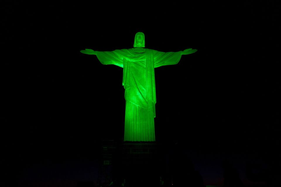 The iconic Christ the Redeemer statue in Rio de Janeiro, Brazil, illuminated in green as part of Tourism Irelands Global Greening initiative to celebrate the island of Ireland and St Patrick.