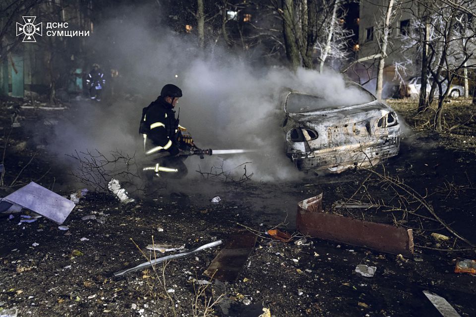 Firefighters extinguish a fire after a Russian rocket attack hit a multistorey apartment building in Sumy, Ukraine (Ukrainian Emergency Service via AP)