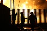 thumbnail: Press Eye - Belfast - Northern Ireland - 11th July  2018 

General view fire officers cooling down a building at the  Hope Street bonfire at Sandy Row in South Belfast.

It comes after the PSNI issued a notice informing the public that paramilitaries intend to orchestrate serious disorder against police officers on the Eleventh night.

Photo by Kelvin Boyes / Press Eye.