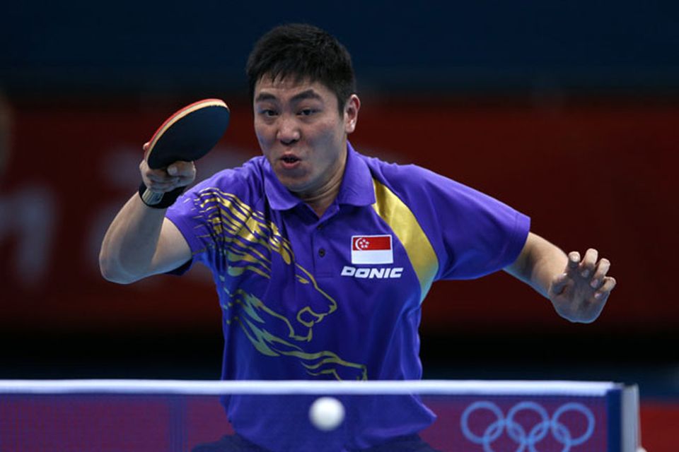 LONDON, ENGLAND - JULY 30:  Ning Gao of Singapore returns the ball during his Men's Singles Table Tennis fourth round match against Wang Hao of China on Day 3 of the London 2012 Olympic Games at ExCeL on July 30, 2012 in London, England.  (Photo by Feng Li/Getty Images)
