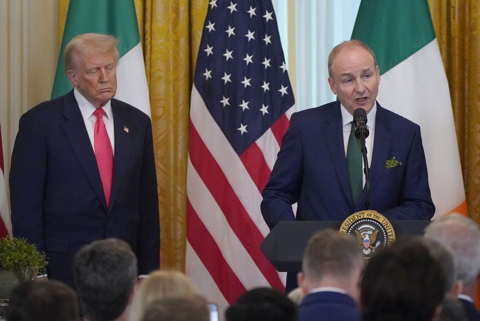 Taoiseach Micheal Martin and US President Donald Trump during the St Patrick’s Day Reception and Shamrock Ceremony in the the East Room of the White House (Niall Carson/PA)