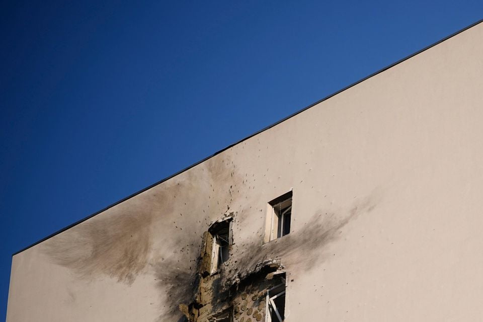 An apartment building where a downed Ukrainian drone fell in Sapronovo village, outside Moscow (AP)