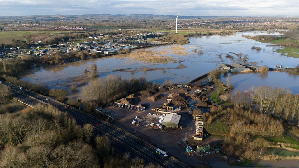 Some roads were closed but vehicles were able to get past flooded fields in Wanlip, Leicestershire (Jacob King/PA)