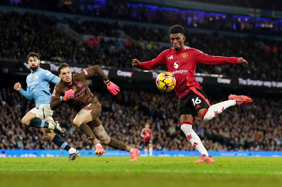 Amad Diallo, right, sealed a derby victory for United at City in December (Martin Rickett/PA)