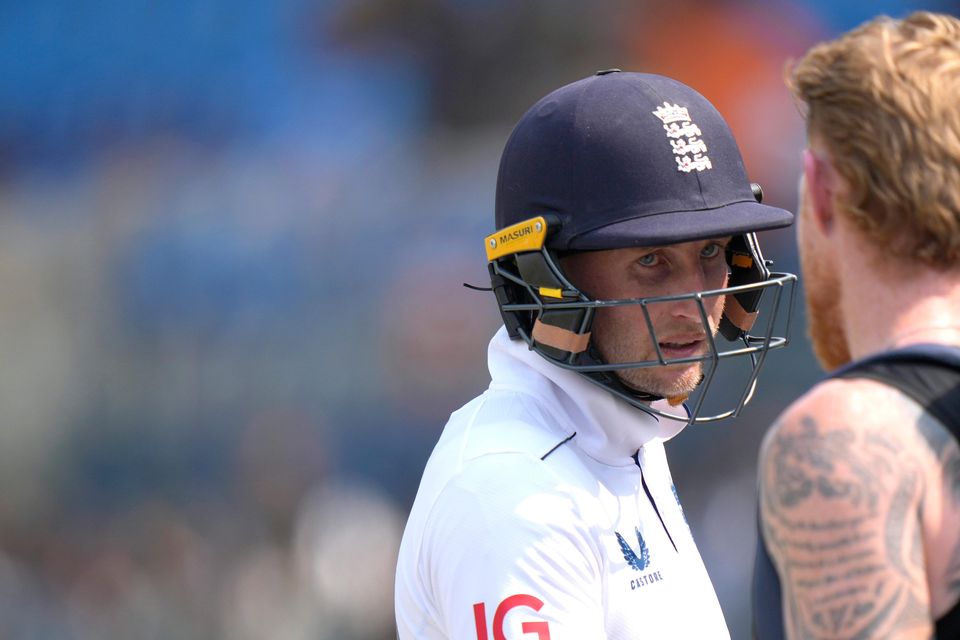 Joe Root, left, is congratulated by Ben Stokes (Anjum Naveed/AP)