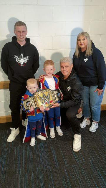 Ollie Beverland, his brother Carson and parents Dylan and Victoria meet Cody Rhodes at the SSE Arena in Belfast
