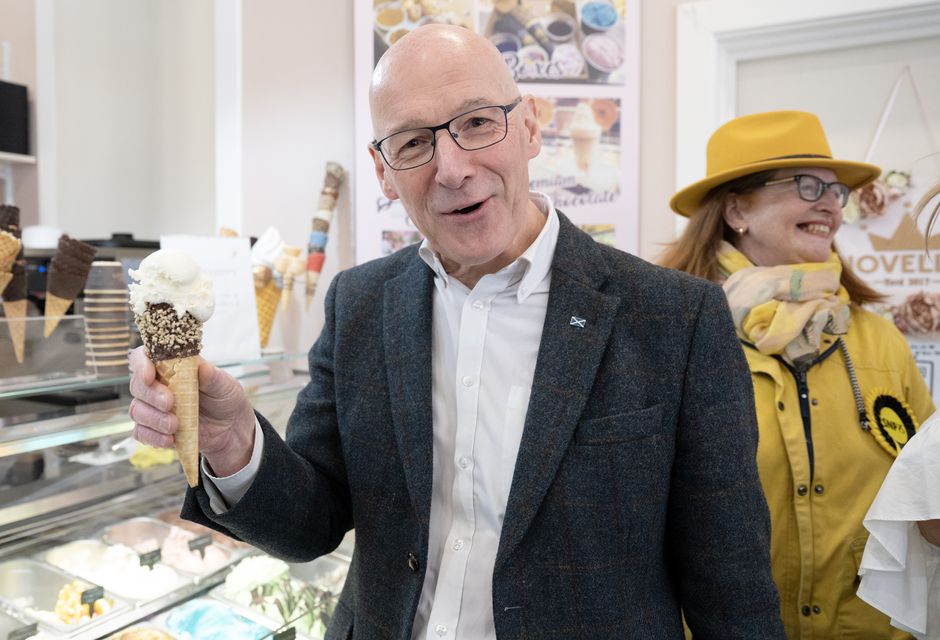 SNP leader John Swinney followed in the footsteps of countless politicians before him when he posed for a photo with an ice cream while out campaigning (Lesley Martin/PA)