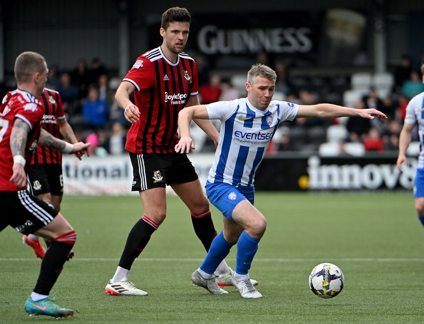 6Crusaders' Adam Leckey in action with Coleraine’s  Stephen Lowry