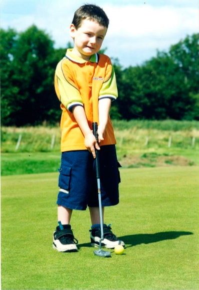 A young Timmy Jordan lines up a putt