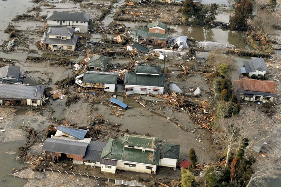 An aerial view shows residential area affected by tsunami in Sendai, northern Japan Saturday, March 12, 2011  after Japan's biggest recorded earthquake slammed into its eastern coast Friday