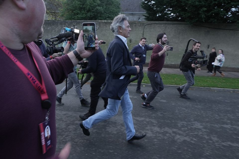 Gerry Hutch running away from the count centre in Dublin (Brian Lawless/PA)