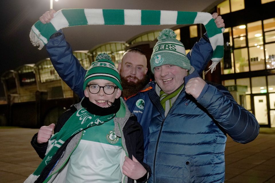 Shamrock Rovers fans Cian McCormack (left), 12, Eamon MacCormaic (right), and Cian’s father, Paraic McCormack, arrive for the match (Brian Lawless/PA)