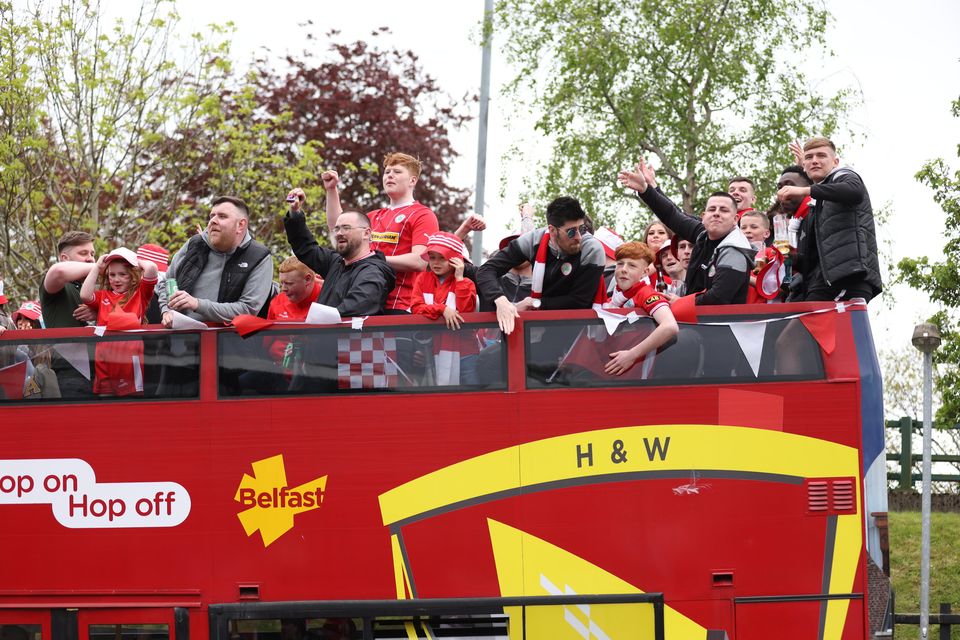 Irish Cup winners Cliftonville Football Club arrive at the Devinish bar on an open top bus to meets supporters.  Picture by Peter Morrison