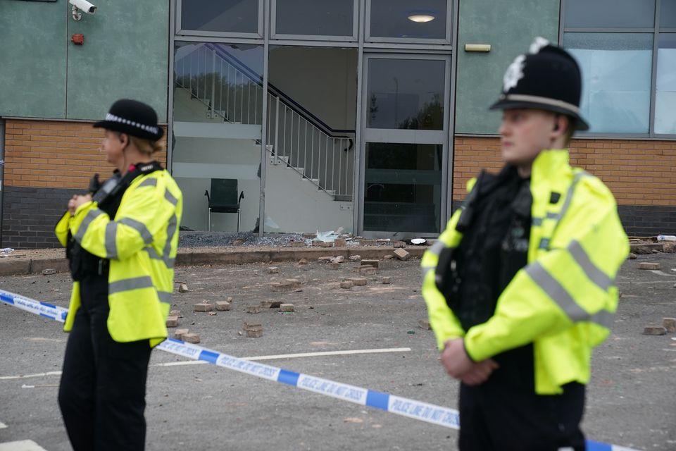 Police guarding the hotel on August 5 (Jacob King/PA)