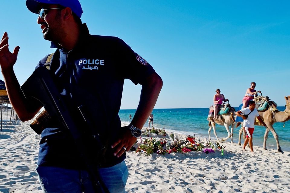 SOUSSE, TUNISIA - JUNE 30:  Armed police continue to patrol Marhaba beach in Sousse, where 38 people were killed in last Fridays terror attack on June 30, 2015 in Sousse, Tunisia. British police have been deployed to the area in one of the biggest counter terror operations since the London bombings on 7 July 2005.  (Photo by Jeff J Mitchell/Getty Images)