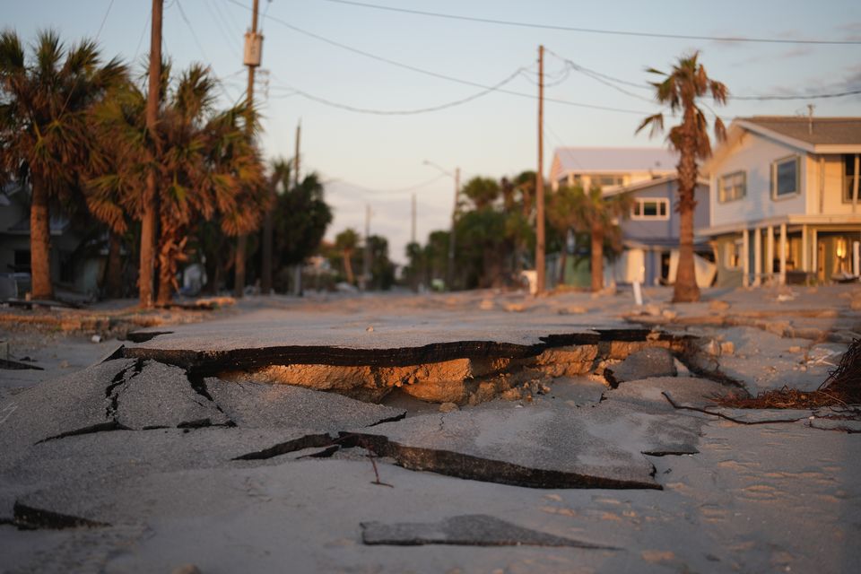 A road lies broken in Manasota Key, Florida following the passage of Hurricane Milton (Rebecca Blackwell/AP)