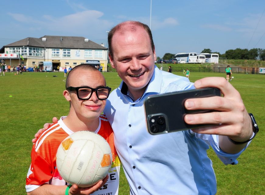 Sports Minister Gordon Lyons taking a selfie with Jay Beatty as he attends the Ulster GAA Games For All Festival at Kickham’s GAC in Randalstown on Saturday.