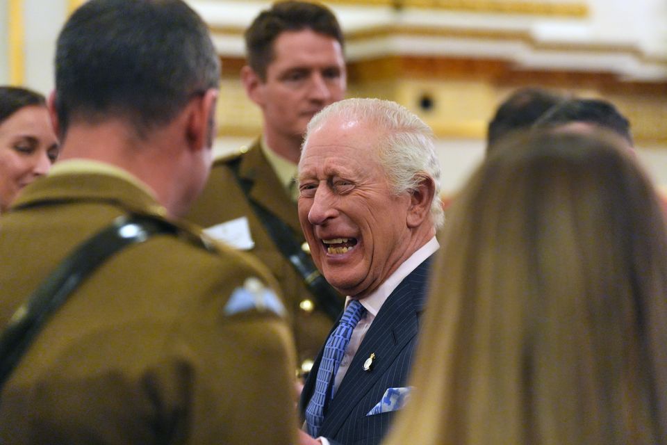 The King meeting guests at Buckingham Palace (Jonathan Brady/PA)