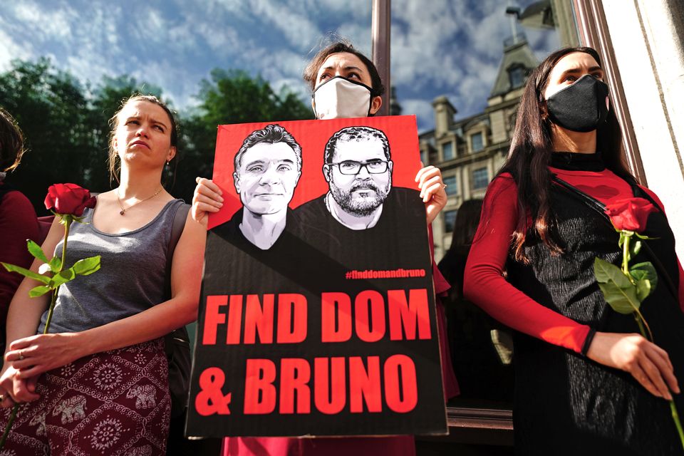 People take part in a vigil outside the Brazilian Embassy in London for Dom Phillips and Bruno Araujo Pereira (Victoria Jones/PA)