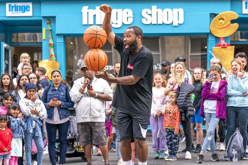 A performer outside the Edinburgh Festival Fringe shop during last year’s festival (Jane Barlow/PA)