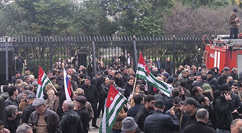 Protesters with Abkhazian flags gathered outside the parliament building on Friday (AIASHARA Independent Agency via AP)