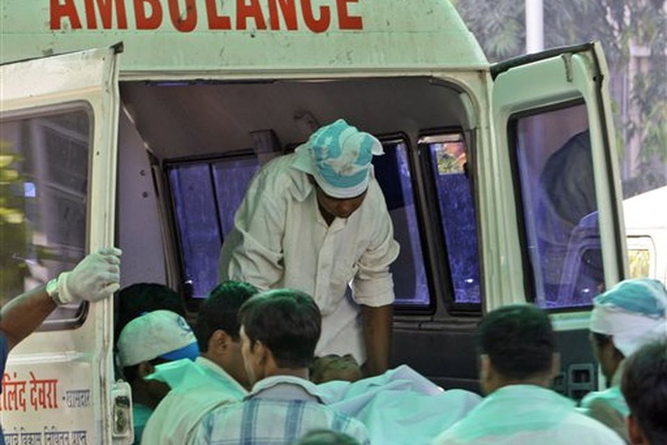 A terrorist attack victim's body is shifted to an ambulance to be taken for postmortem outside the St. Georges Hospital in Mumbai, India, Thursday, Nov. 27, 2008. Teams of gunmen stormed luxury hotels, a popular restaurant, hospitals and a crowded train station in coordinated attacks across India's financial capital, killing at least 101 people, taking Westerners hostage and leaving parts of the city under siege Thursday, police said. A group of suspected Muslim militants claimed responsibility. (AP Photo/Gurinder Osan)