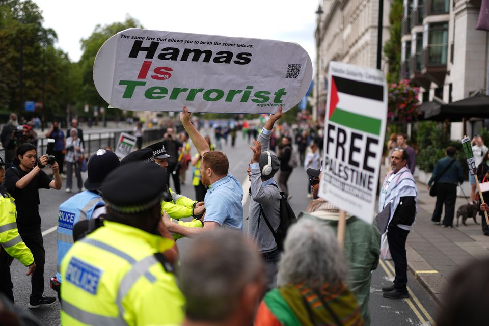 Counter-protesters briefly held up the demonstration (Jordan Pettitt/PA)