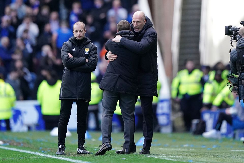 Philippe Clement embraces Brendan Rodgers following the 3-3 draw at Ibrox (Andrew Milligan/PA)
