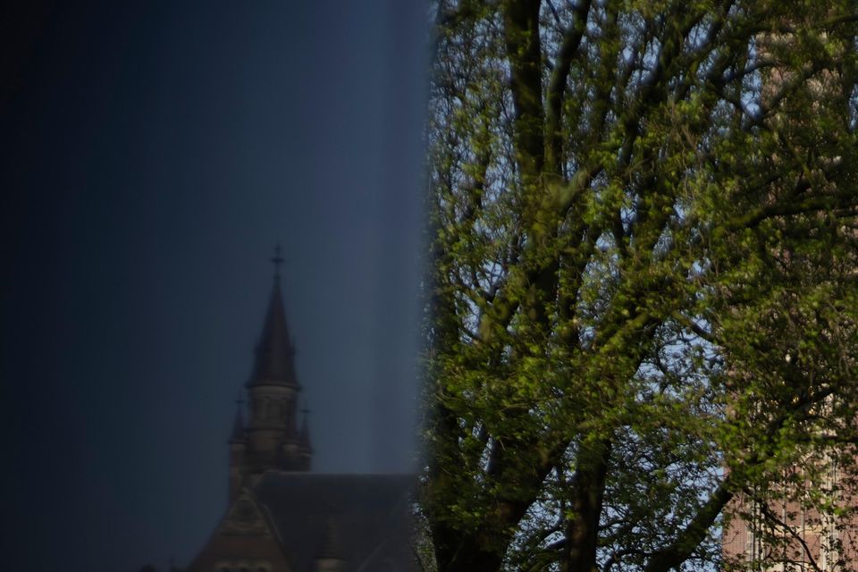 The Peace Palace housing the International Court of Justice is reflected in a monument in The Hague (AP/Peter Dejong)