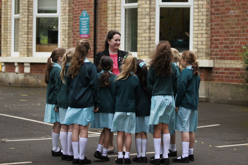 Leonora Martin speaking to pupils outside Penrhyn in east Belfast (Liam McBurney/PA)