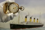 thumbnail: A gold plated Waltham American pocket watch, the property of Carl Asplund, is seen in front of a modern water colour painting of the Titanic by CJ Ashford at Henry Aldridge and Son auctioneers in Devizes, Wiltshire, England Thursday, April 3, 2008. The locket and one of the rings were recovered from the body of Carl Asplund who drowned on the Titanic, they are all part of the Lillian Asplund collection of Titanic related items.