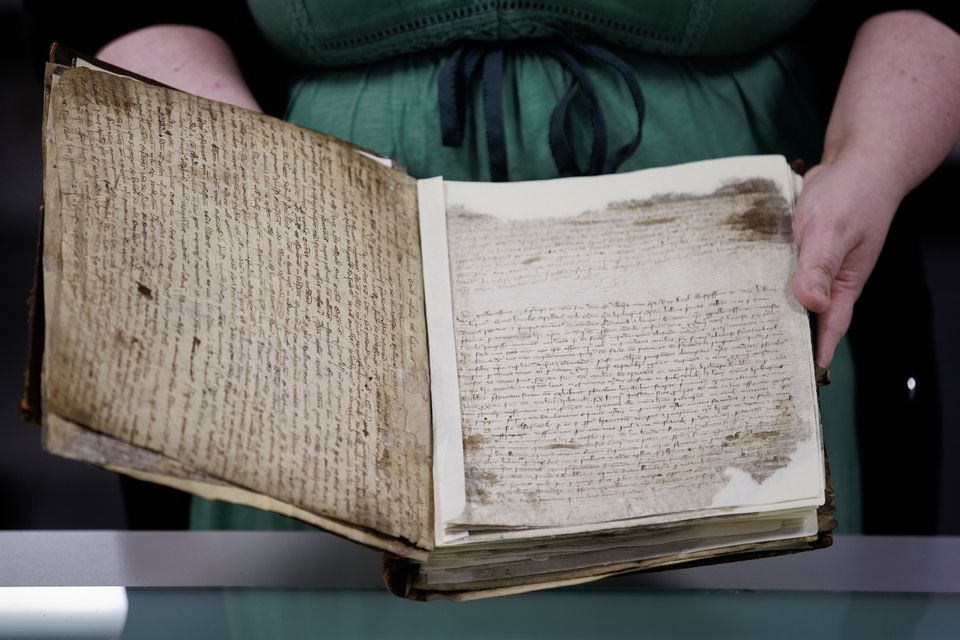 One of the ecclesiastical registers being worked on at the Public Records Office of Northern Ireland (Liam McBurney/PA)