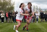 thumbnail: Tyrone's Kate Daly and Grainne Cassidy celebrate with the trophy following their victory over Mayo