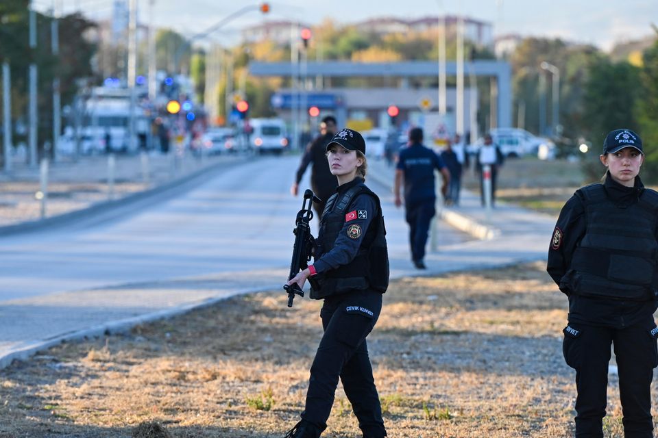 Emergency and security teams outside Turkish Aerospace Industries (Mert Gokhan Koc/AP)