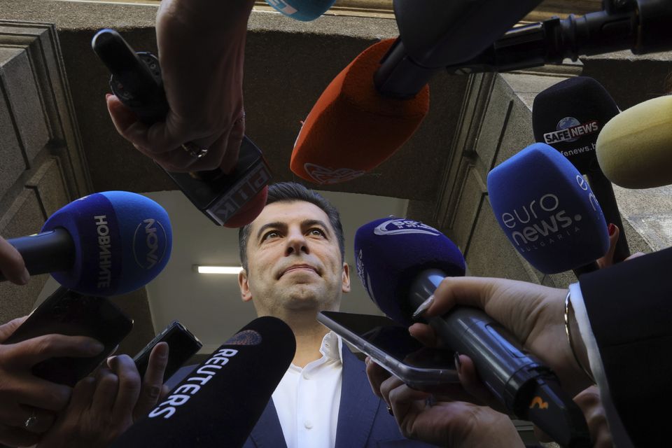 Former Bulgarian prime minister Kiril Petkov speaks to the media after voting in Sofia on Sunday (Valentina Petrova/AP)