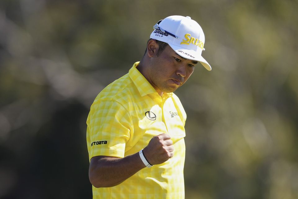 Matsuyama reacts after sinking a putt on the 18th hole to win (Matt York/AP)