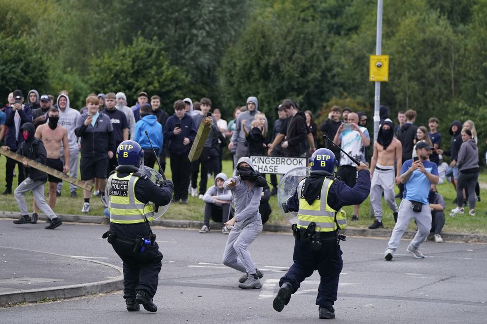 Police face violent protesters during an anti-immigration demonstration near the Holiday Inn Express in Rotherham on August 4 (PA)