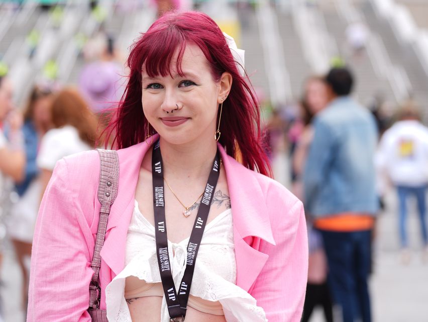 Martyna Smoniewska, 19, is celebrating her BTec results after she received an email with her results while in the queue for the concert (James Manning/PA)