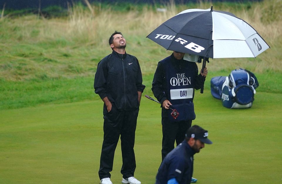 Australia’s Jason Day (left) reacts after missing a birdie on the 18th green during day four of The Open at Royal Liverpool (Peter Byrne/PA)