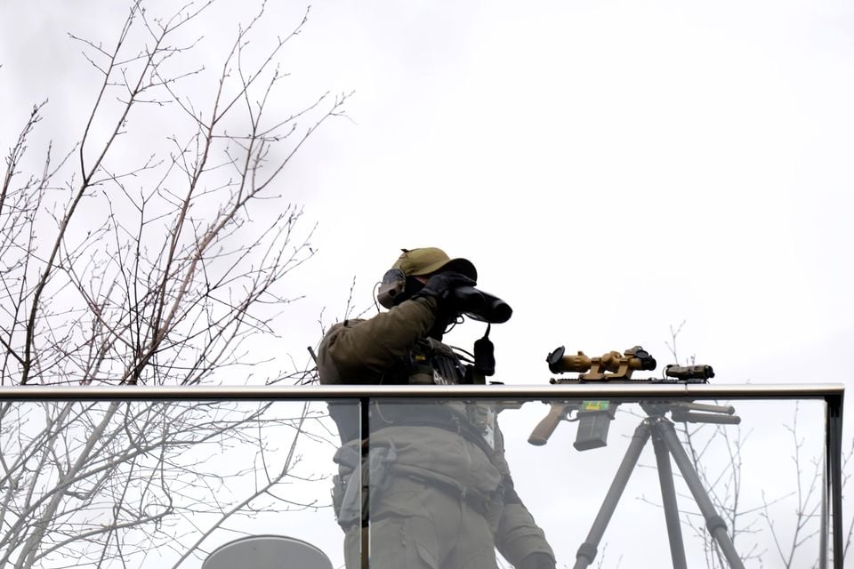 A security guard in position during the Munich Security Conference at the Bayerischer Hof Hotel in Munich (Matthias Schrader/AP)