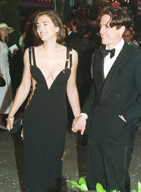 Hugh Grant arriving with actress Elizabeth Hurley for the charity premiere of Four Weddings And A Funeral (PA)