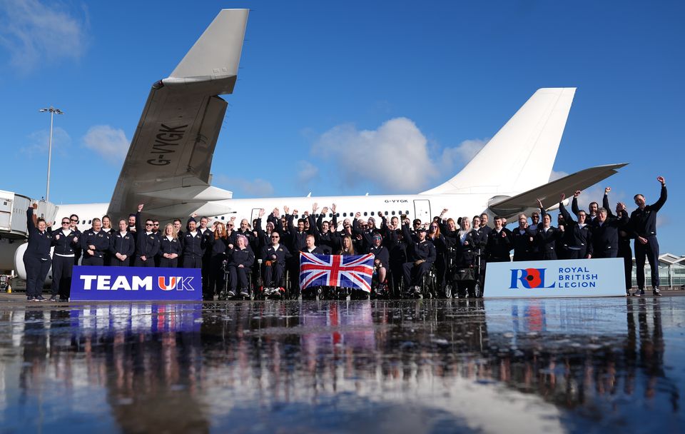 Royal British Legion’s Team UK on the tarmac at Birmingham Airport as the team depart for the Invictus Games in Canada (Joe Giddens/PA)