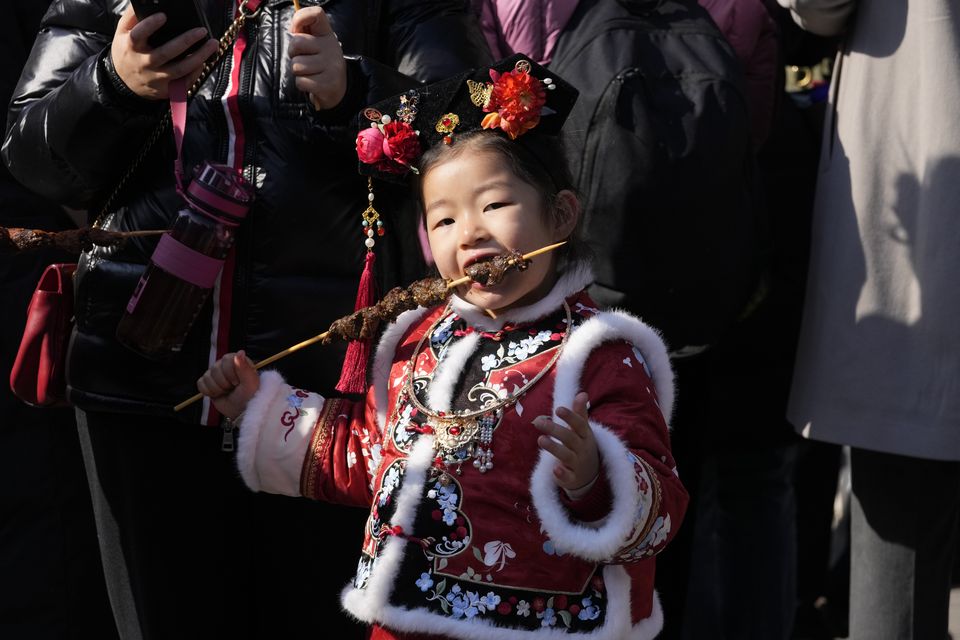 Traditional costumes are a common feature of the celebrations (AP)