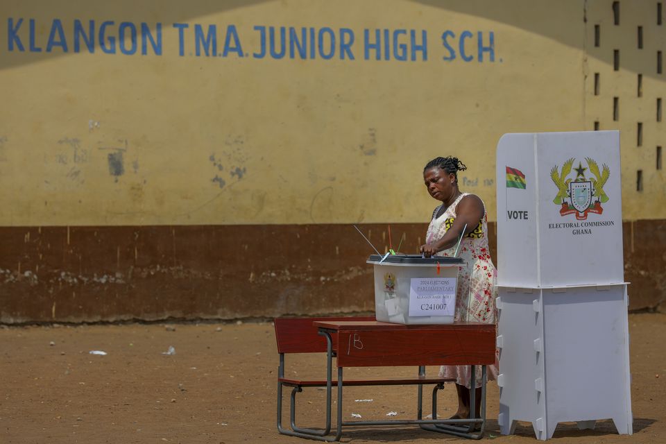 A woman casts her ballot at a polling station in Jamestown, Accra (Misper Apawu/AP)