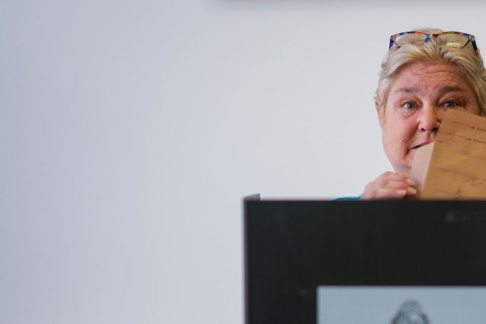 Yeni Varone, a nurse, casts her vote in the presidential run-off election in Montevideo, Uruguay (AP/Natacha Pisarenko)