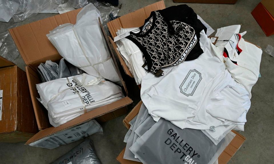 Fake designer clothes found during the Dungiven search. Credit: PSNI 