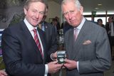 thumbnail: Taoiseach Enda Kenny (left) presents the Prince of Wales (right) with a limited edition commemorative medal in honour of John Philip Holland, Irish inventor of the modern submarine, at the Marine Institute in Galway, on day one of a four day visit to Ireland with the Duchess of Cornwall. PRESS ASSOCIATION Photo. Picture date: Tuesday May 19, 2015. See PA story ROYAL Ireland. Photo credit should read: Arthur Edwards/The Sun/PA Wire