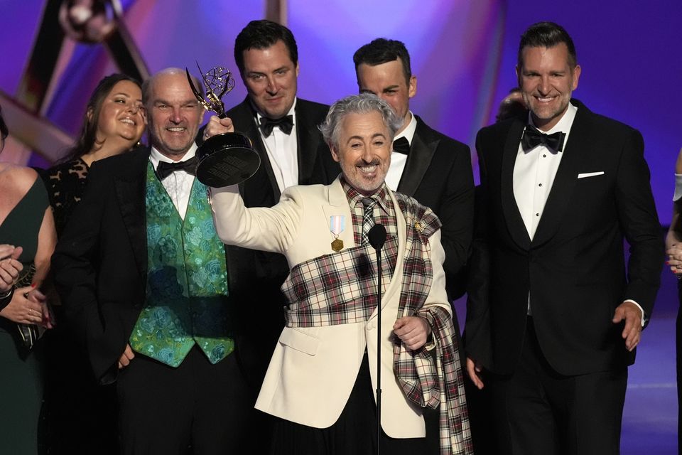 Alan Cumming and the team from The Traitors accept the award for outstanding reality competition program during the 76th Primetime Emmy Awards (AP Photo/Chris Pizzello)