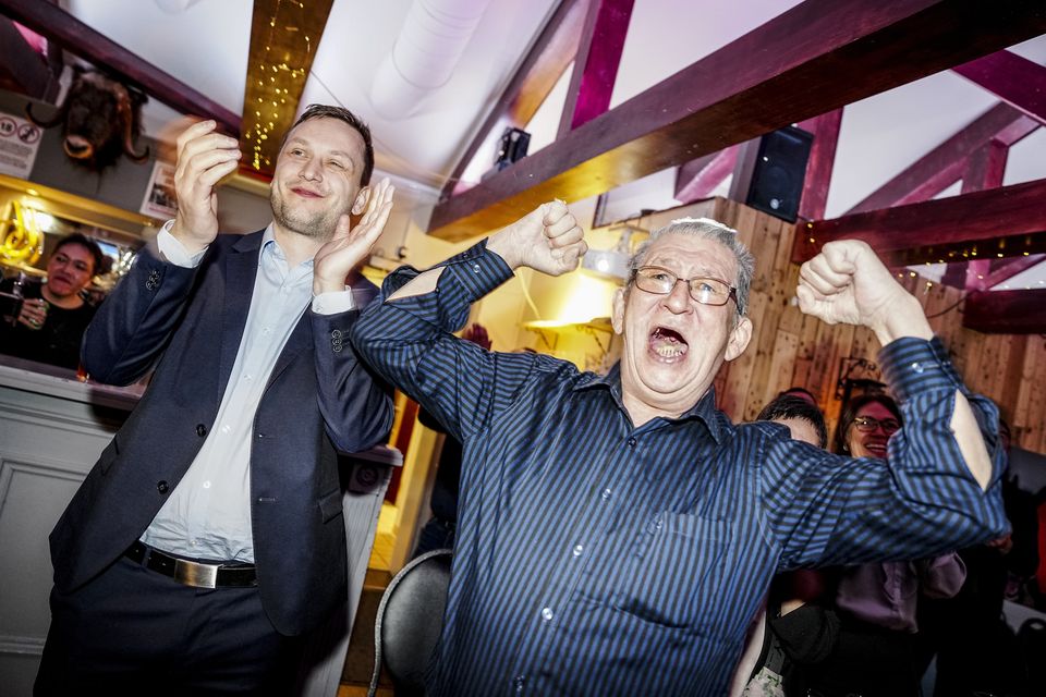 Chairman of Demokraatit, Jens-Frederik Nielsen, left, celebrates during an election party as he is poised to become Greenland’s next prime minister (Mads Claus Rasmussen/Ritzau Scanpix via AP)